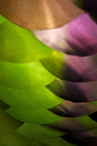 Abstract photograph of colored metal reflective patterns.